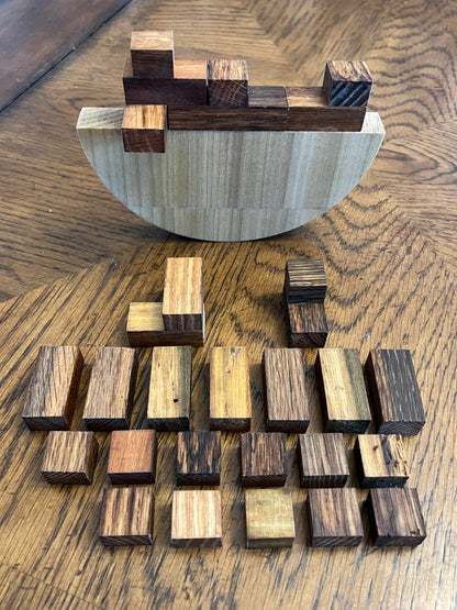 Wooden wall art with geometric shapes on a wooden surface