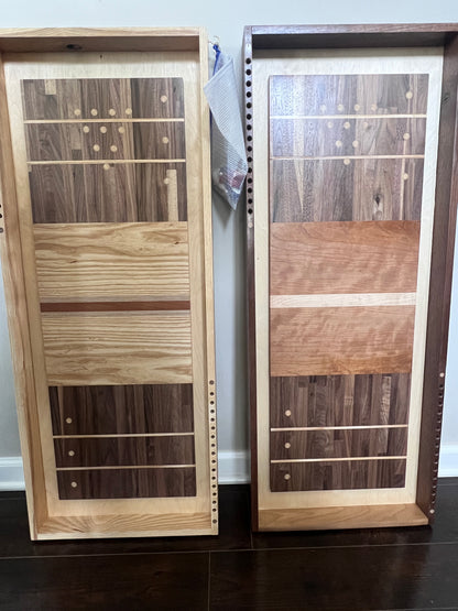 Wooden panel samples displayed on a stand with a neutral background