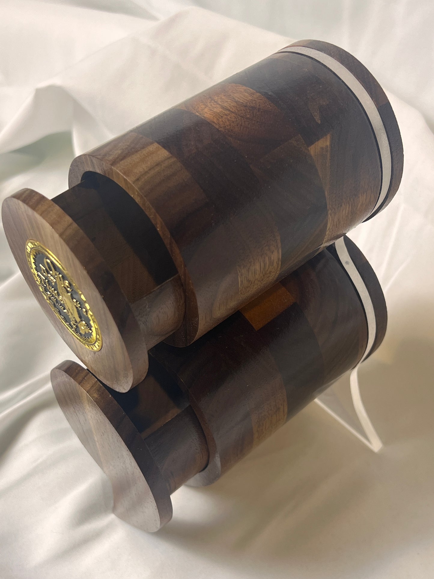 A black walnut semicolon keepsake box with a gold and black "One Day at a Time" coin embedded on the top.