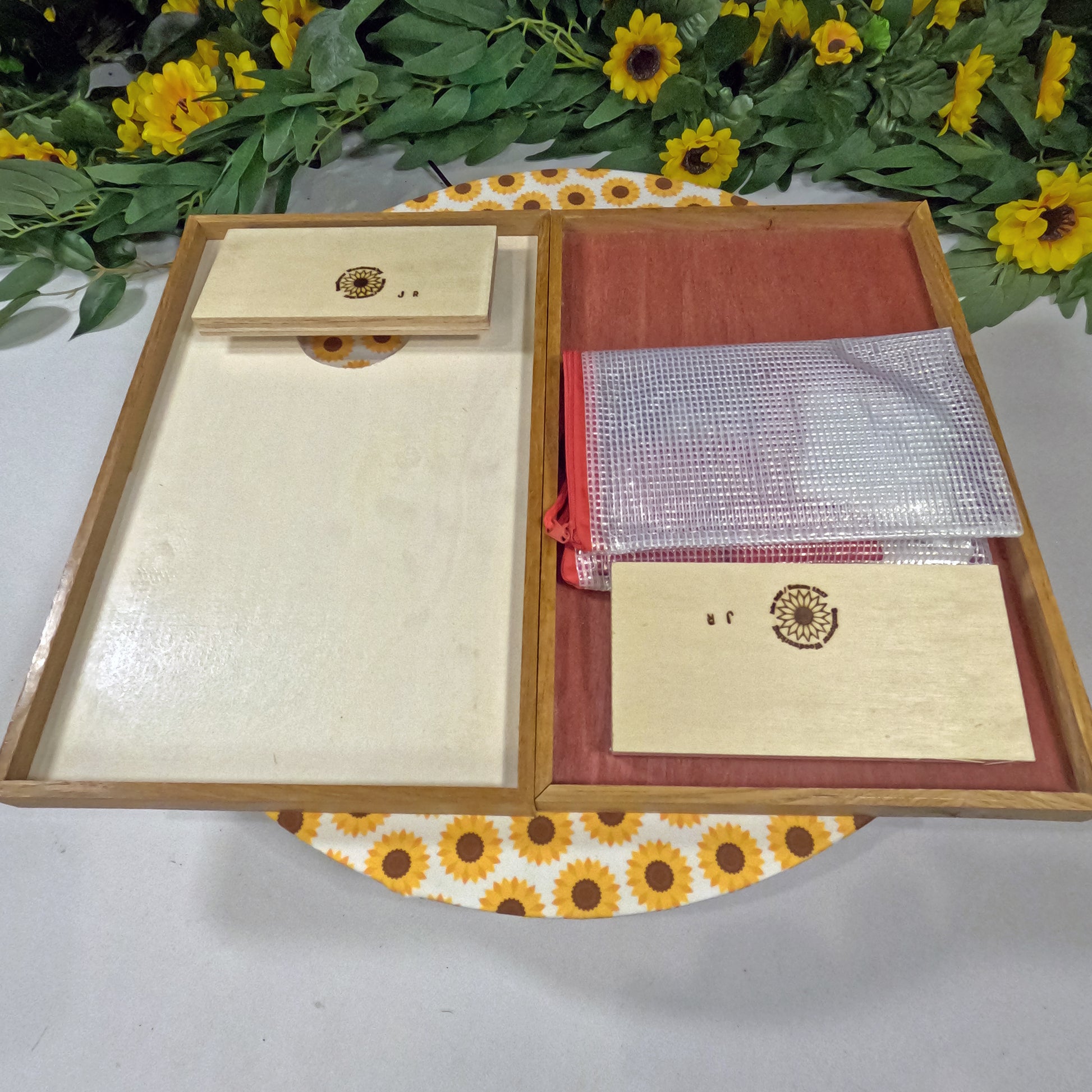 Open wooden cornhole set on a floral-patterned surface
