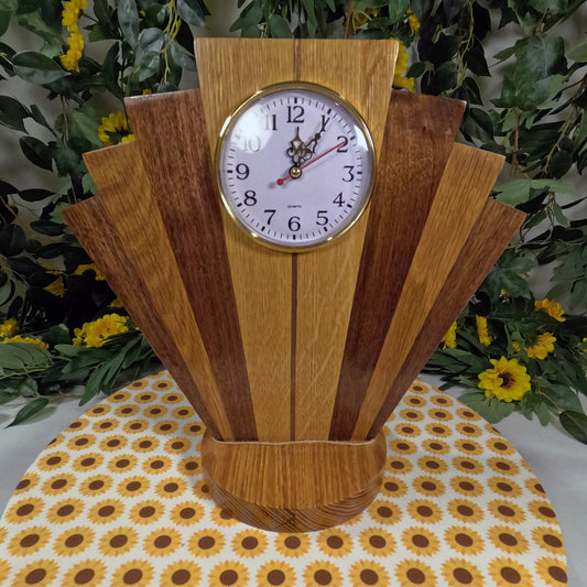 Wooden clock with a decorative design on a tablecloth with floral pattern