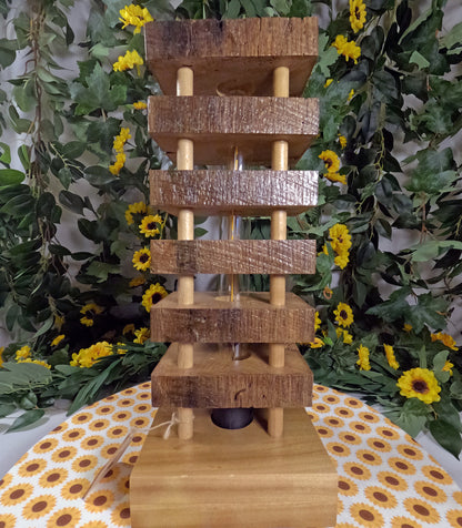 Wooden tiered display with a floral and leafy background