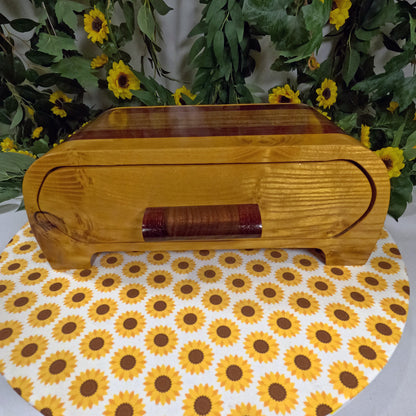 Wooden box with a floral patterned surface underneath