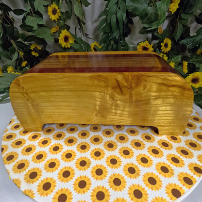 Wooden box on a table with sunflower patterned paper and floral background