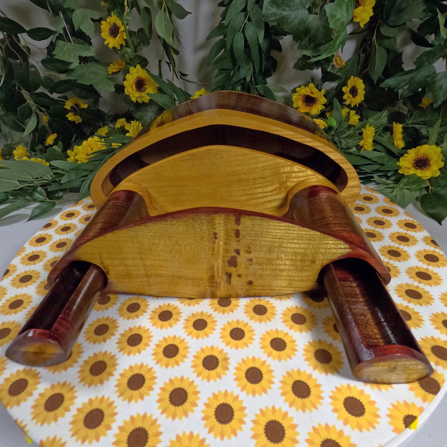 Wooden box with floral and sunflower patterned tablecloth