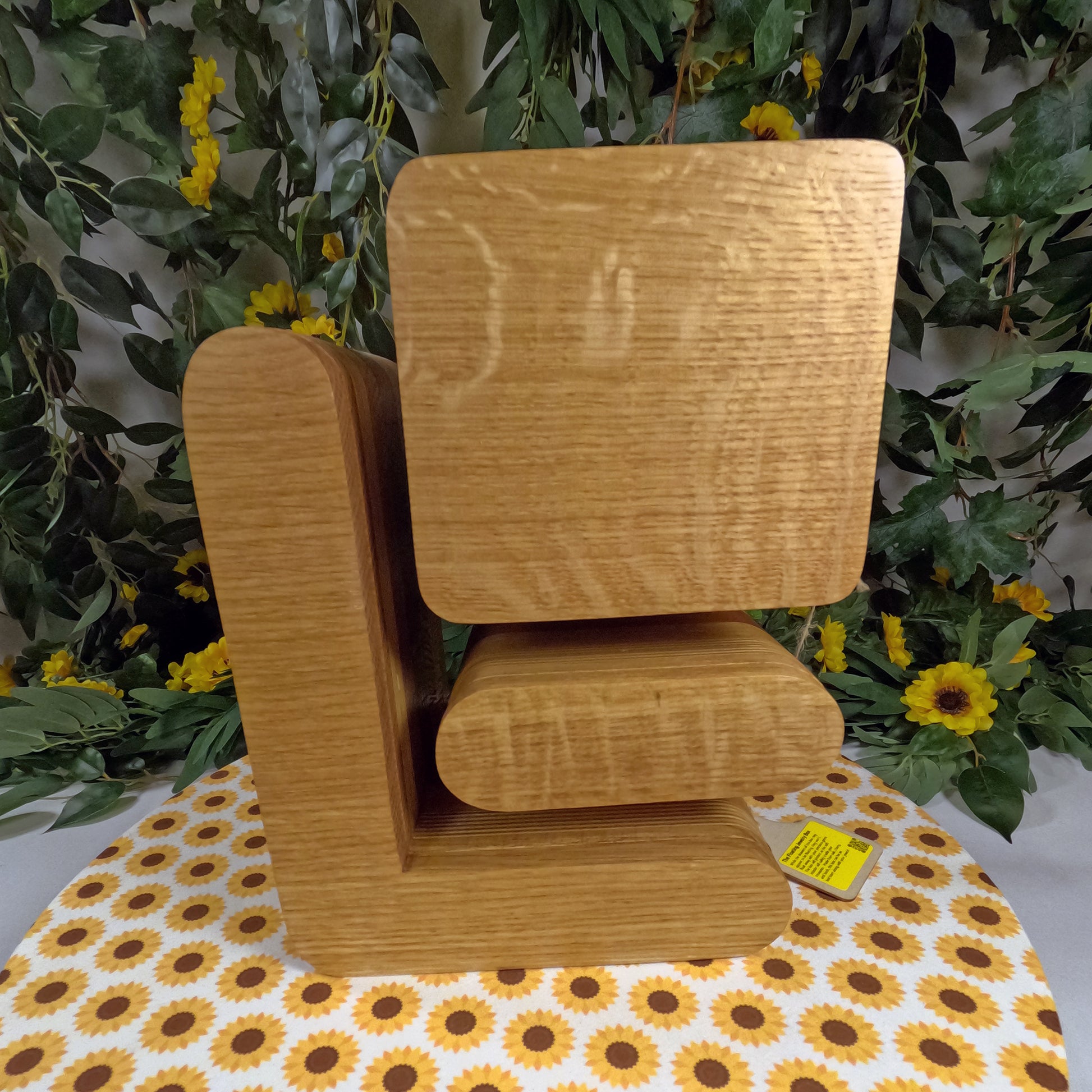 Wooden jewelry on a table with a floral background