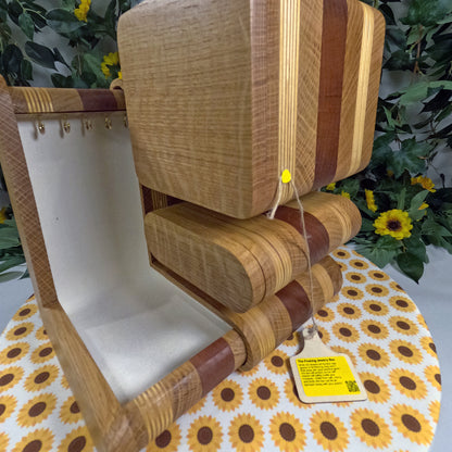 Wooden jewelry box with a tag on a floral  tablecloth