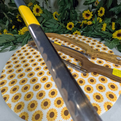 Bread saws on a sunflower-patterned mat with greenery in the background