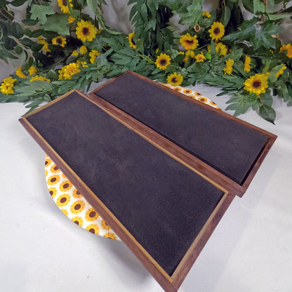 Wooden box on a white surface with sunflower decorations.