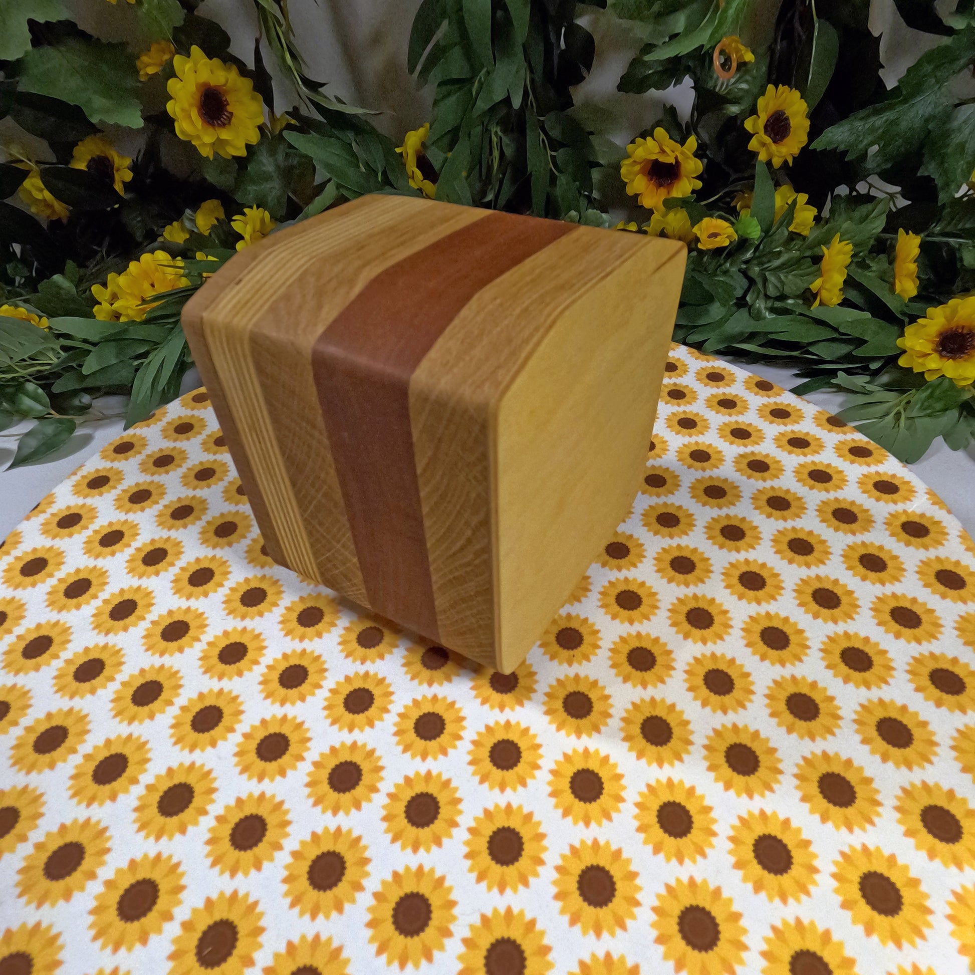 Wooden box on a tablecloth with sunflower pattern