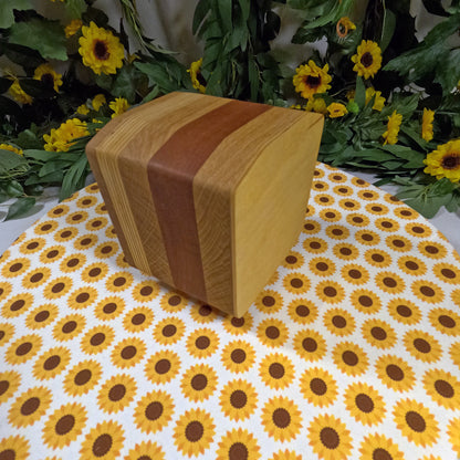 Wooden box on a tablecloth with sunflower pattern