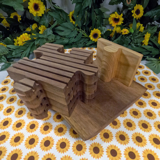 Wooden puzzle-shaped trivets on a tablecloth with sunflower pattern