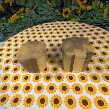 Two wooden boxes on a tablecloth with sunflower pattern