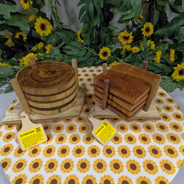 Wooden coasters on a sunflower-patterned tablecloth.