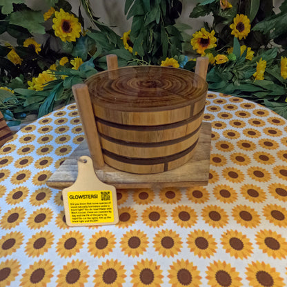 Wooden coasters on a tablecloth with sunflower pattern