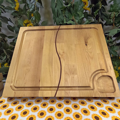 Wooden cutting board on a tablecloth with sunflower pattern