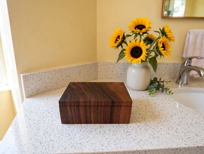 EARZ! black walnut cotton swab box closed on a bathroom vanity