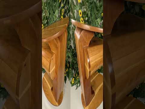 Picture of a video for a pedestal table on a white table with a sunflower and vine backdrop.