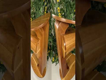 Picture of a video for a pedestal table on a white table with a sunflower and vine backdrop.