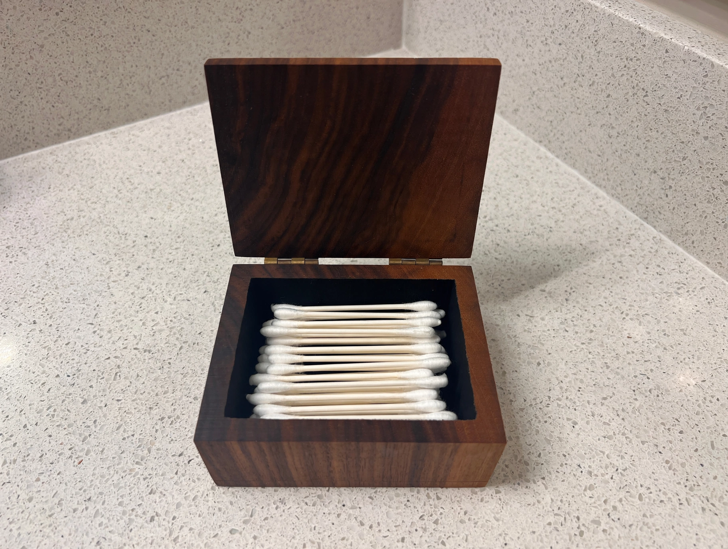 EARZ! box filled with cotton swabs on a bathroom counter